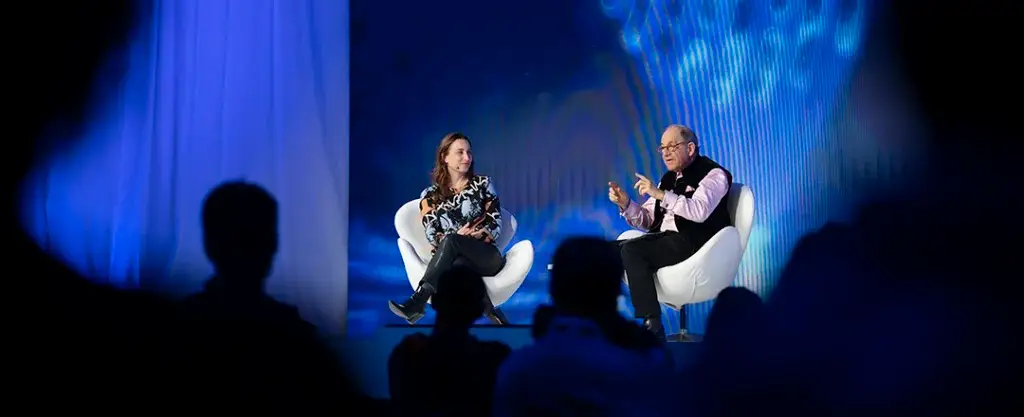 Two speakers seated during a panel discussion at Mobile World Congress Barcelona